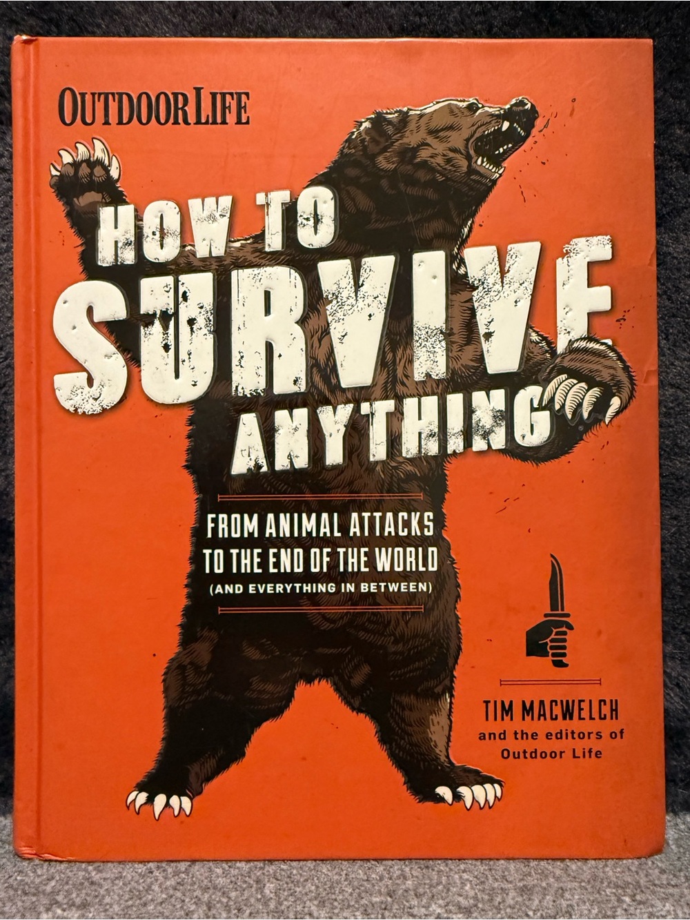 Outdoor Life "How to Survive Anything" Hardcover Book - Orange & Black